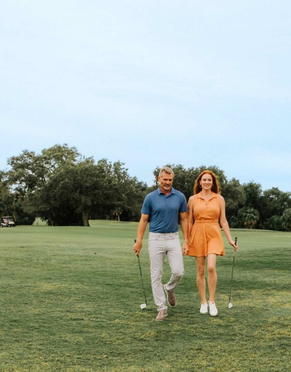 couple playing golf