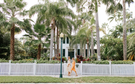 Women walking along a beautiful neighborhood in Key West, Florida.