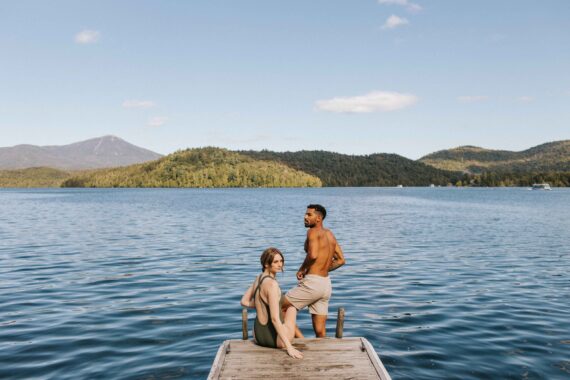 A couple swims in Lake Placid.