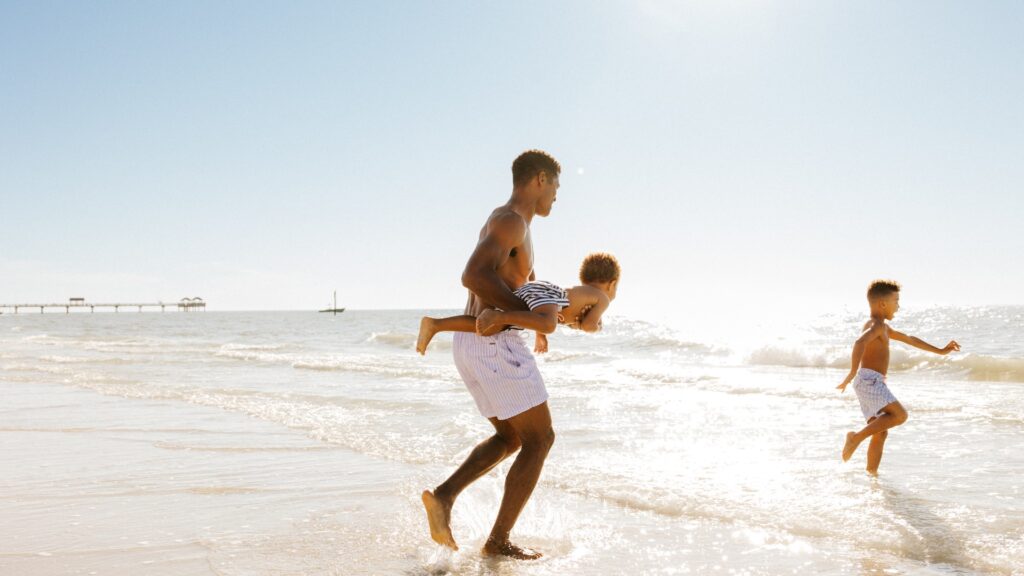Father on Clearwater Beach with sons