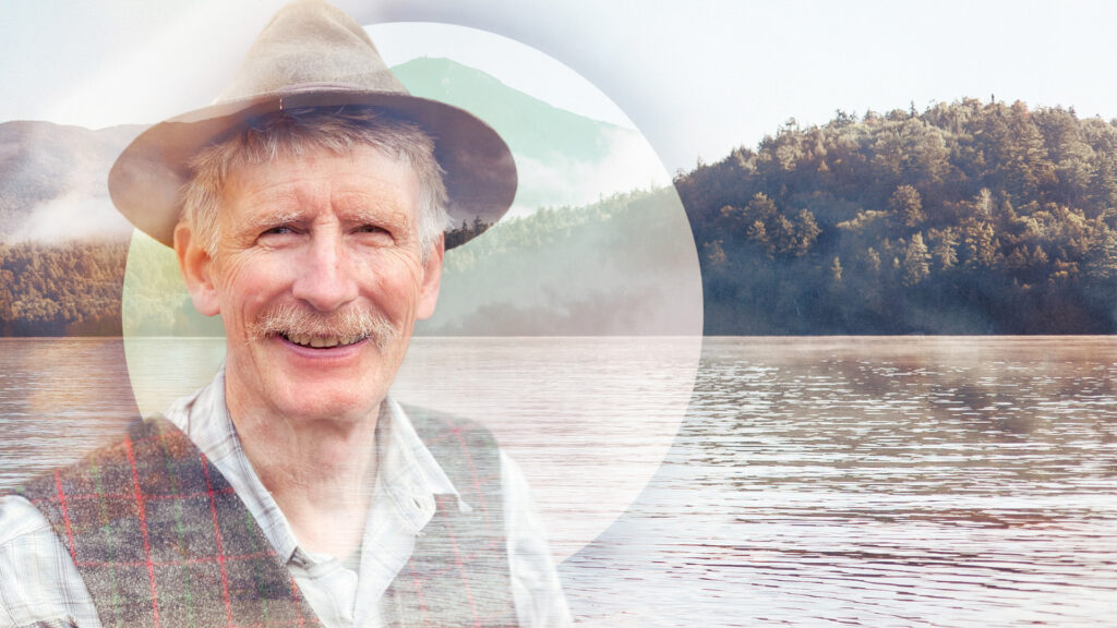 A double exposure of Ed Kanze beside Lake Placid.