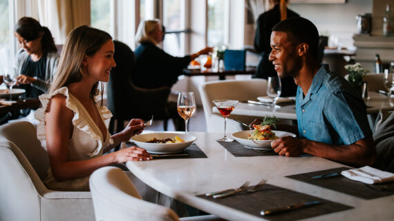 A couple dines at Salt Kitchen & Bar, one of the top restaurants in the Portsmouth NH seacoast.