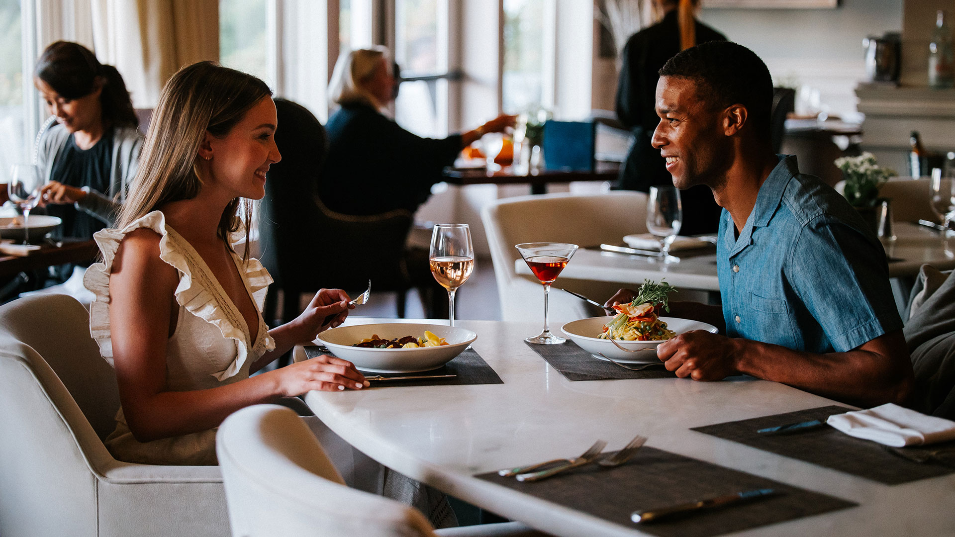 A couple dines at Salt Kitchen & Bar, one of the top restaurants in the Portsmouth NH seacoast.