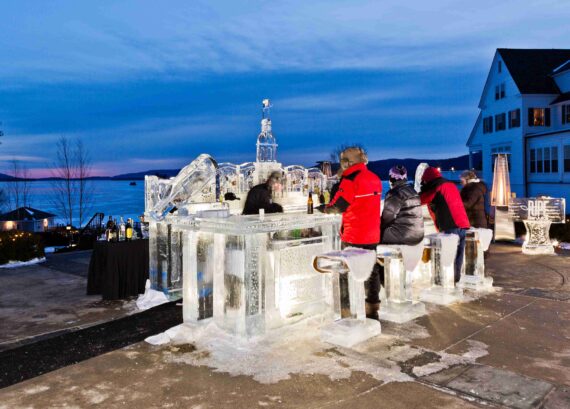 Bartenders sling drinks at the annual Glacier ice bar.