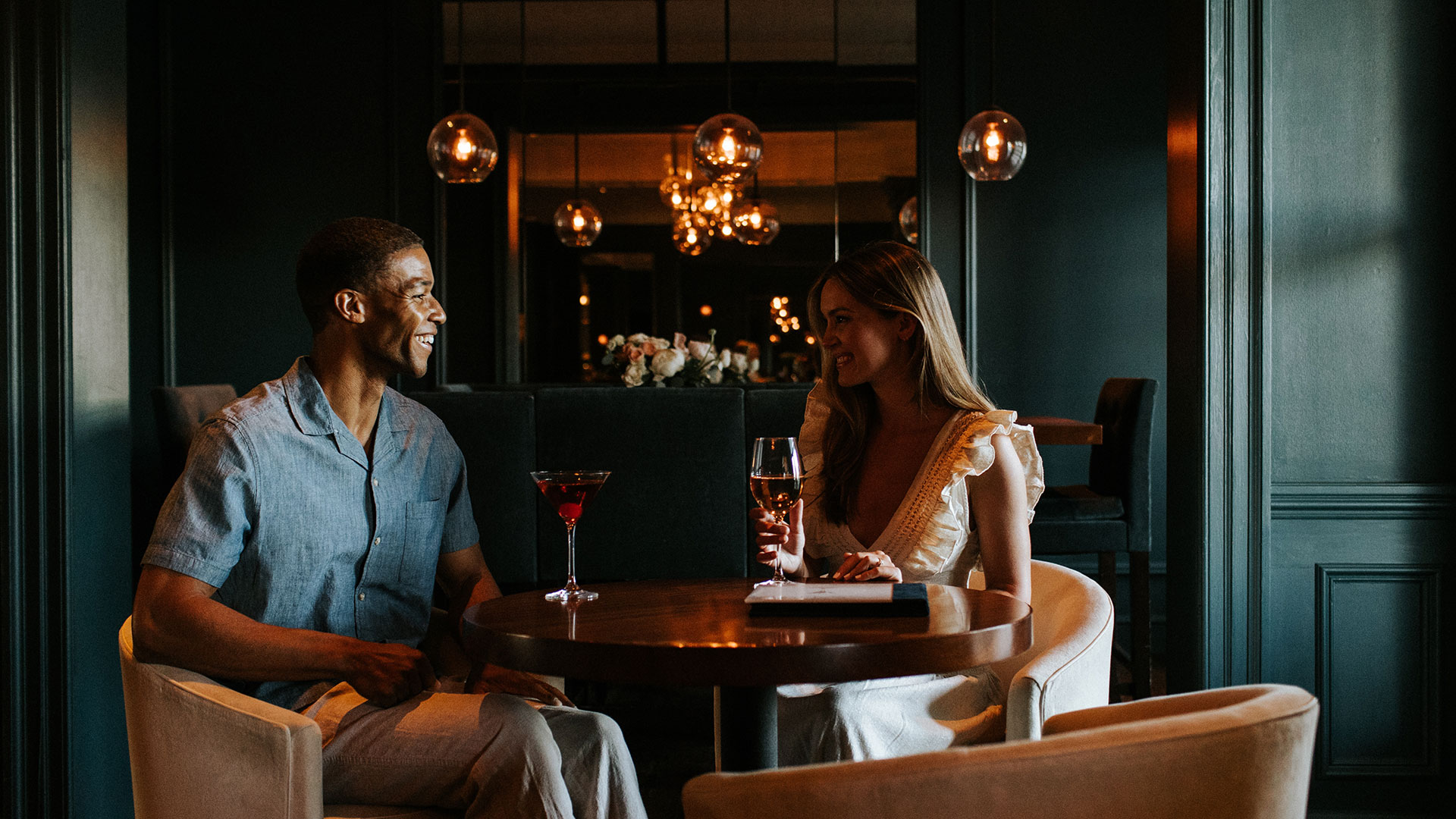 A couple enjoys a pre-dinner cocktail in Salt Kitchen's lounge.