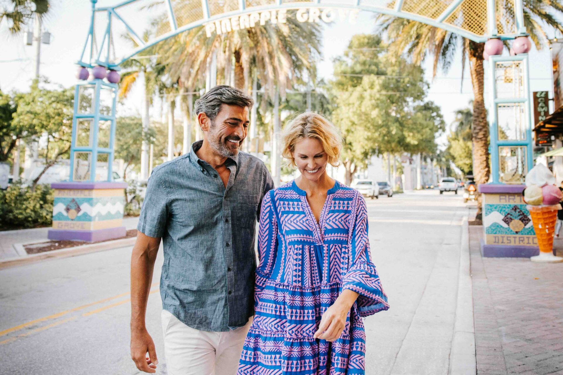 couple walking in pineapple grove