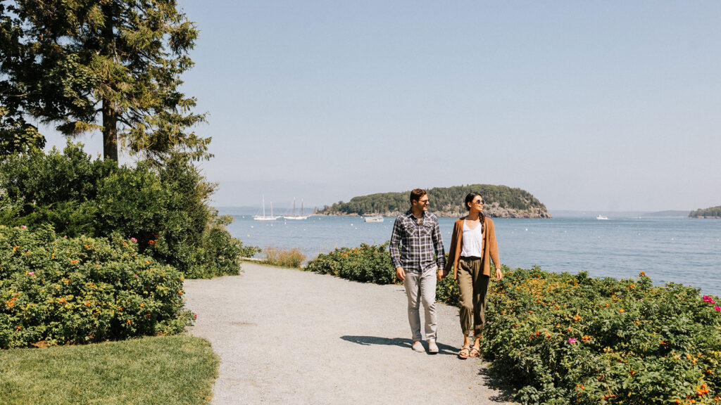 A couple strolls along the Bar Harbor Shore Path.