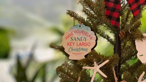 A Florida-themed Christmas ornament on a tree.