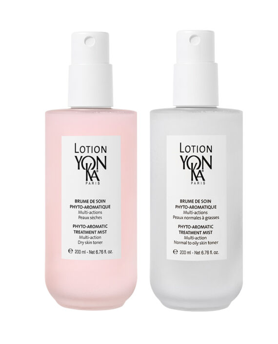 Two Yon-Ka Paris bottles of Phyto-Aromatic Treatment Mist, one pink for dry skin and one clear for normal to oily skin, each with a white spray cap and 200 ml volume displayed on the labels.