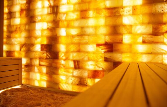 A salt room lined with pink Himalayan salt bricks.