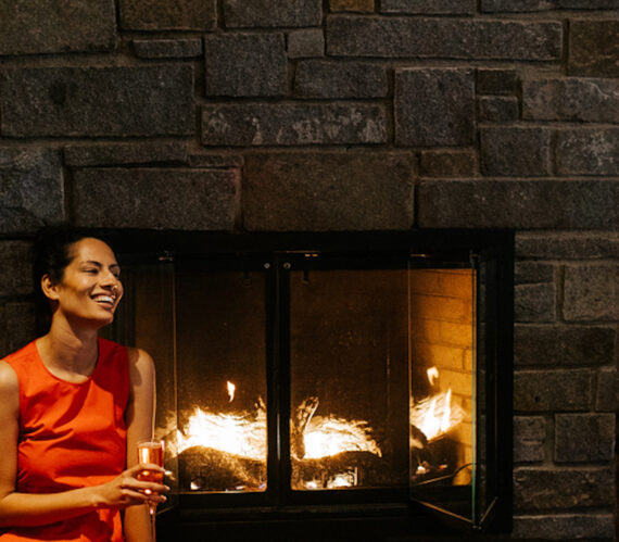 Samoset Woman with Champagne by Fireplace