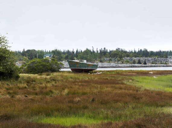 A view of an old boat on a land preserve in Vinalhaven, Maine.