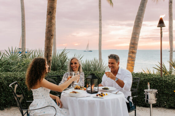 family of three enjoying a latitudes dinner outside
