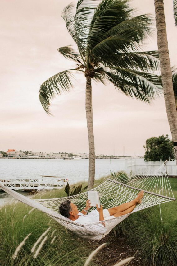 man reading on a hammock