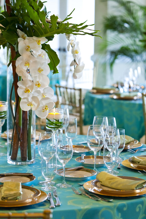 Turquoise wedding tablescape with white flower centerpiece