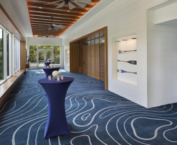 Pre function tables set up outside a hotel meeting space