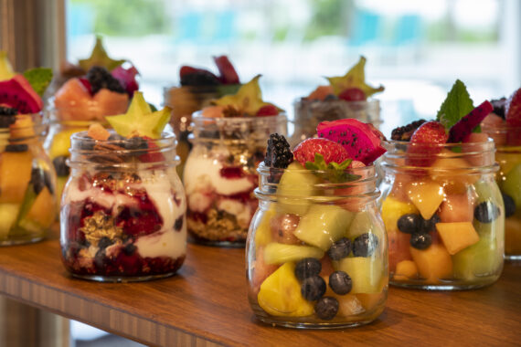Fruit and oatmeal jars arranged on a tray