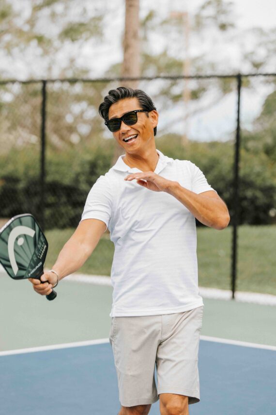 a man playing pickleball