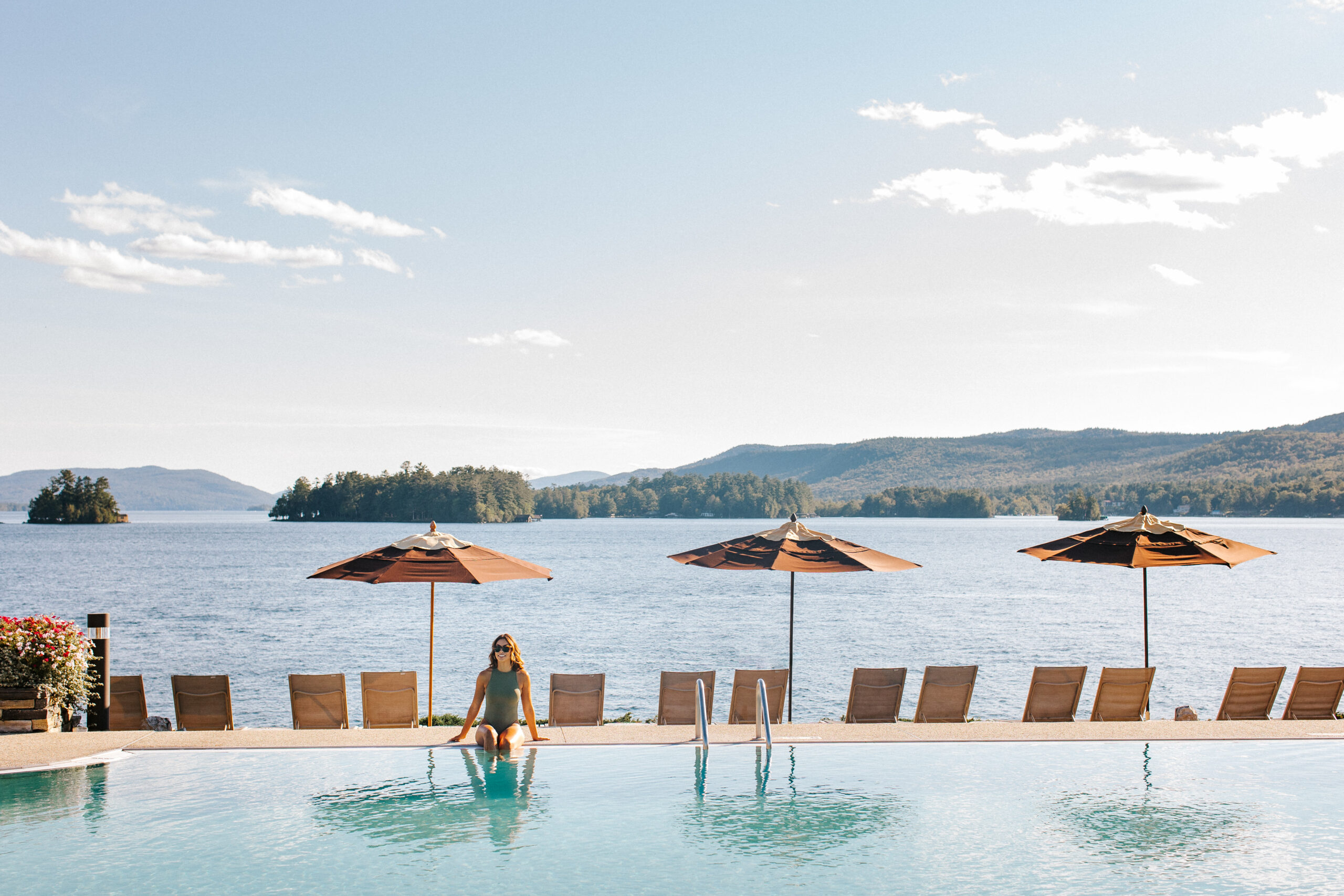 woman sitting by the sagamore outdoor pool