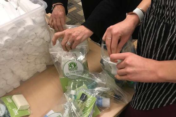A team packages soaps for the Clean the World nonprofit.