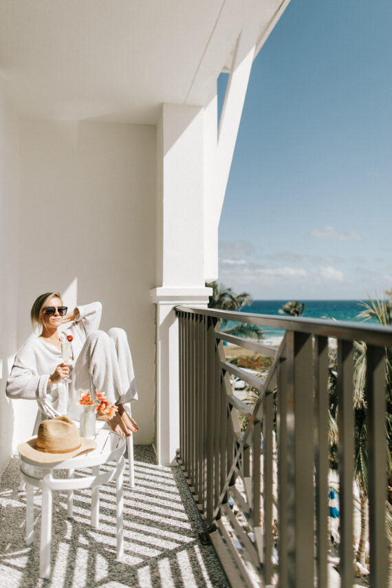 woman sitting on a balcony