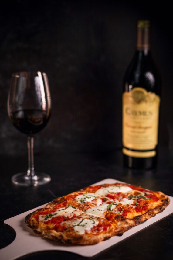 mozzarella flatbread with wine glass