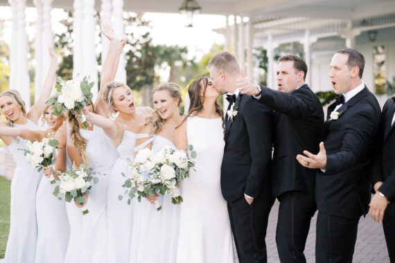 wedding party standing on the lawn