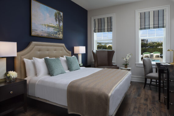 guest room with one bed overlooking the pool
