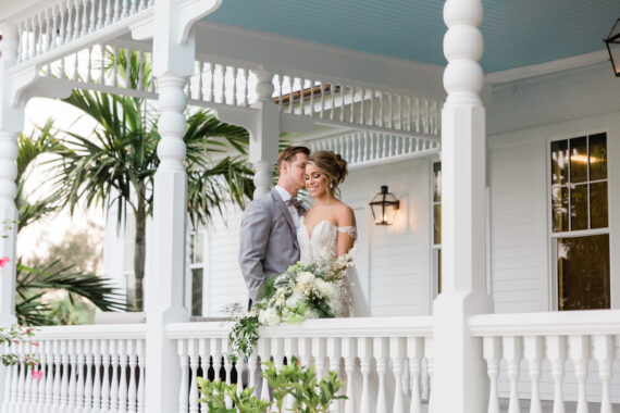 newlyweds on the porch of the belleview inn