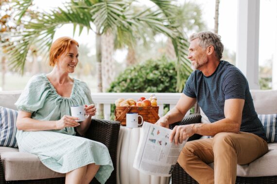 couple sitting outside eating breakfast