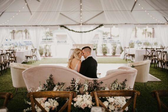couple gazing at each other on the belleview lawn
