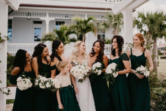 bride and bridesmaids posing for photo