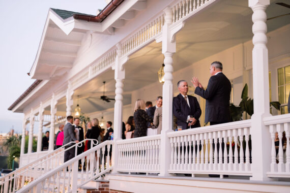 group of people standing on belleview porch