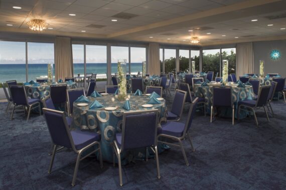 the blu ocean ballroom set up with round tables for an event