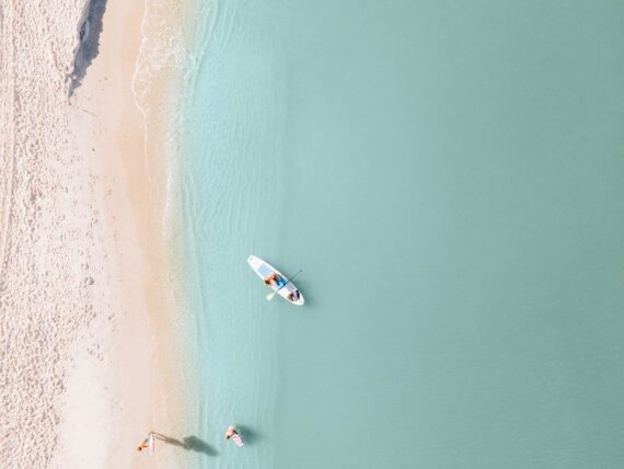 An aerial view of an stand-up paddleboarder.