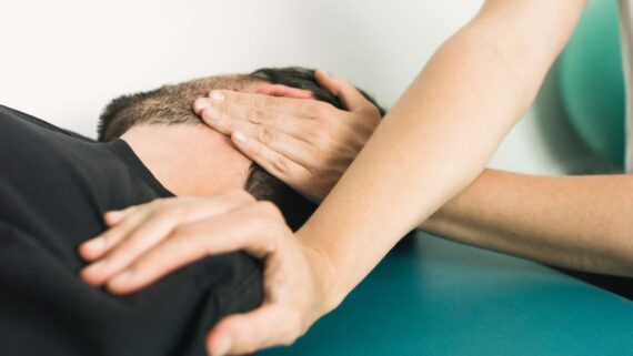 A man receives a chiropractic work.